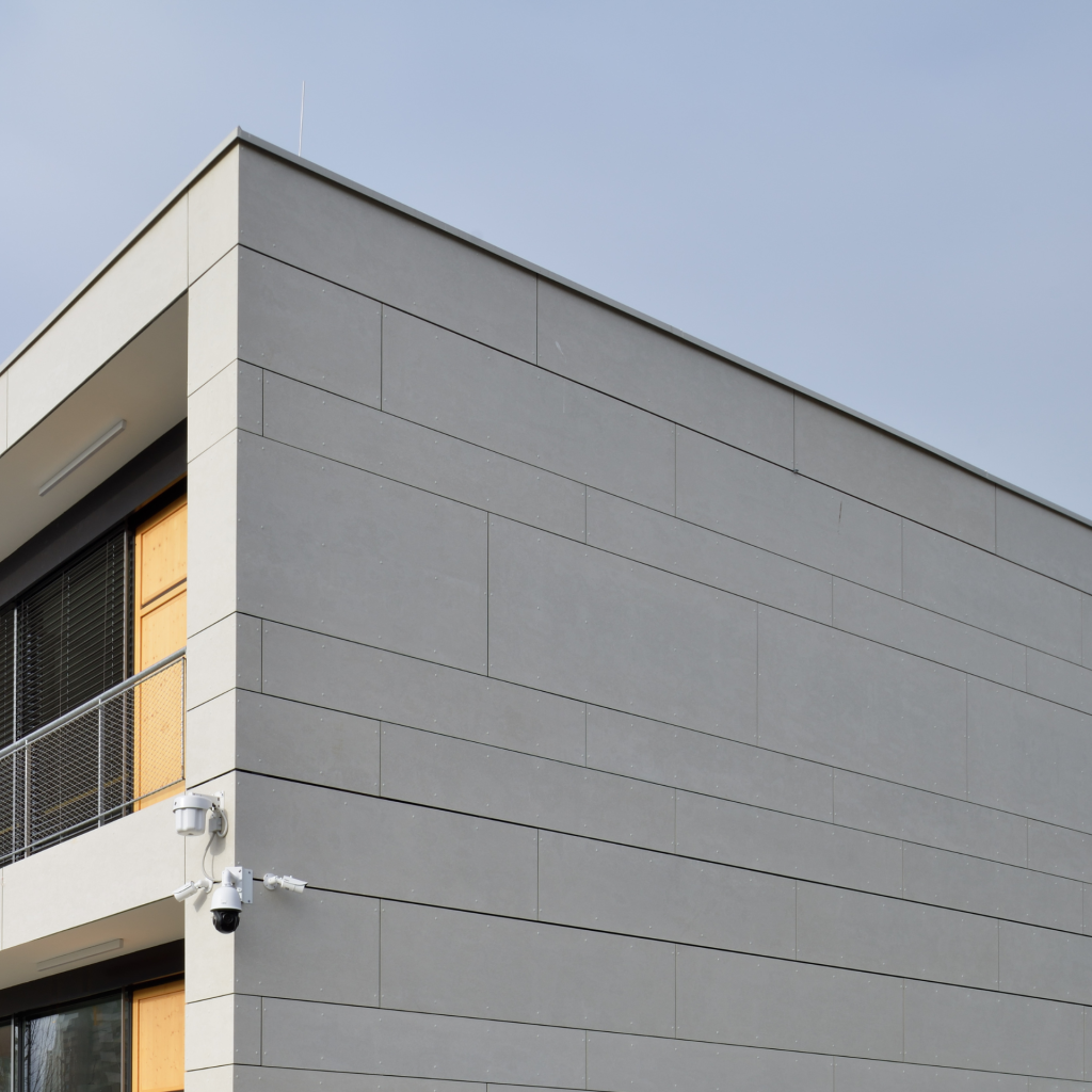 Side wall of commercial building clad with fibre cement panels.